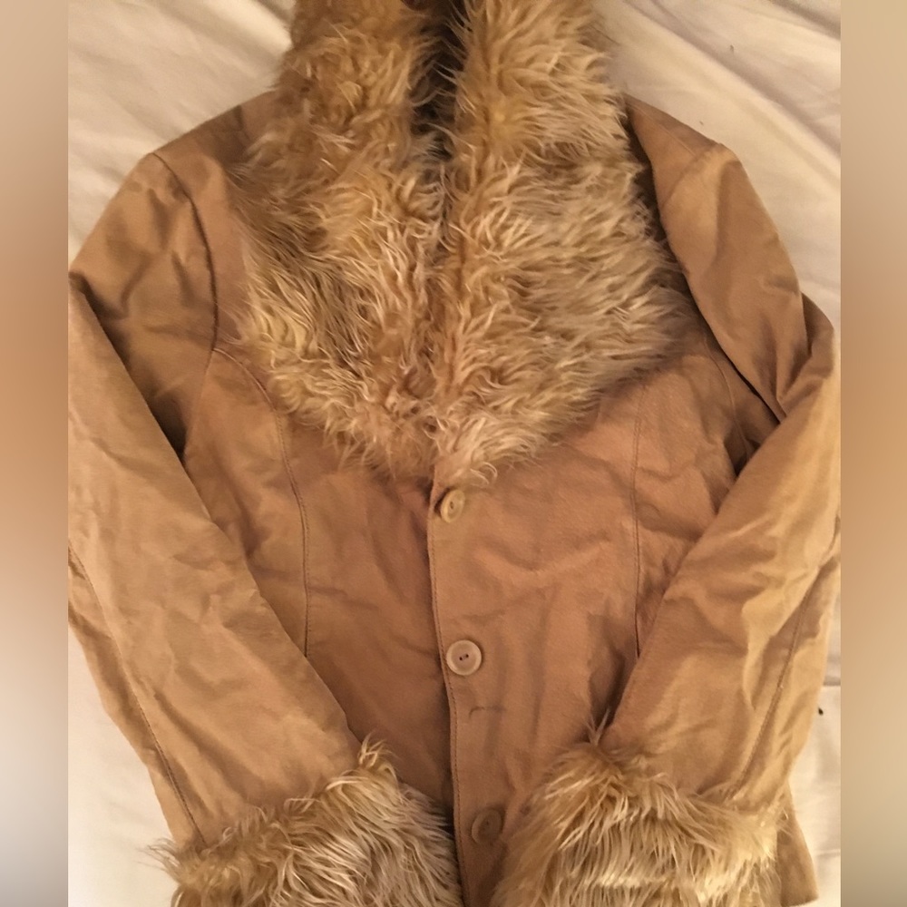 Static suede jacket with fur detail around collar and wristbands. Size medium.